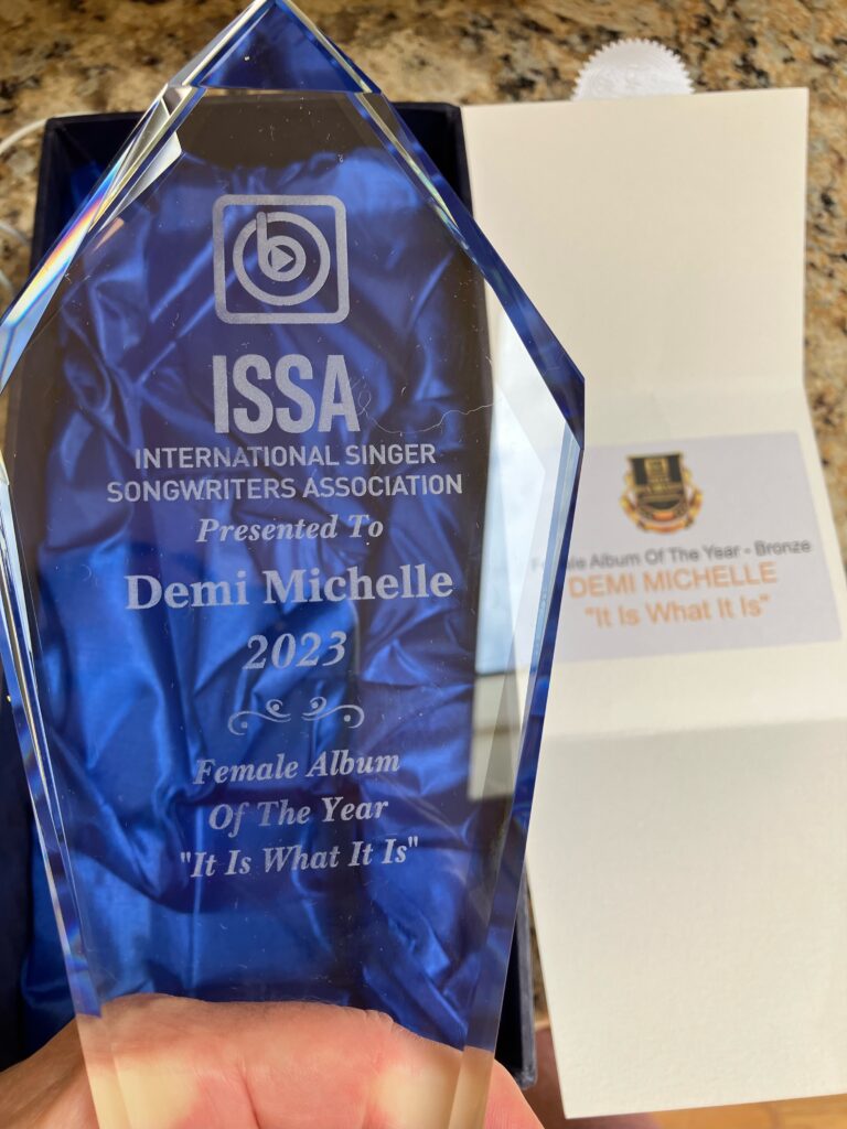 Demi Michelle’s engraved crystal
ISSA, International Singer Songwriters Association, 2023 Female Album of the Year presented to Demi Michelle, It Is What It Is.