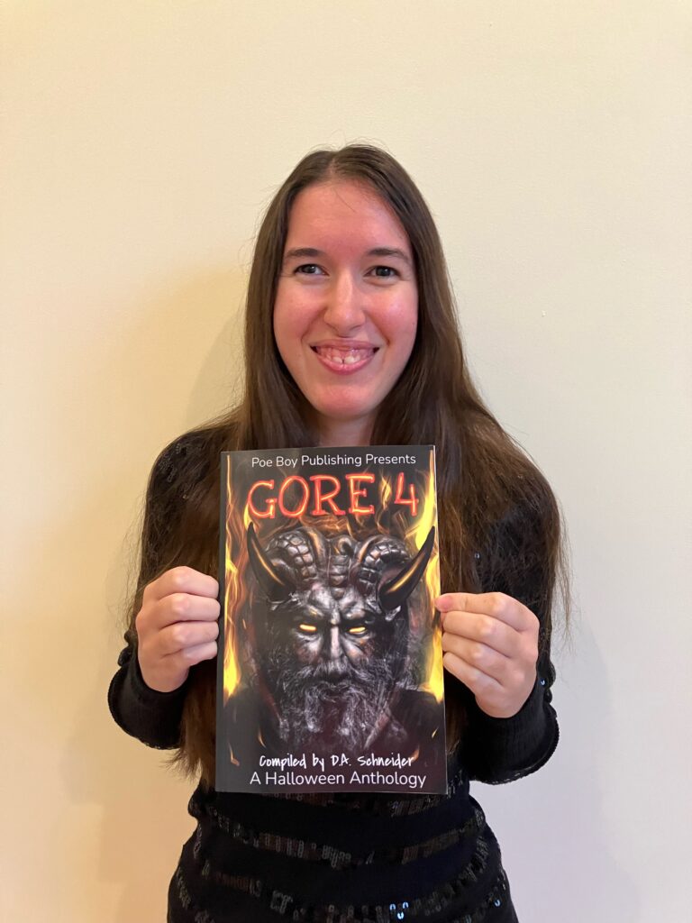 Demi smiling with her copy of Gore 4