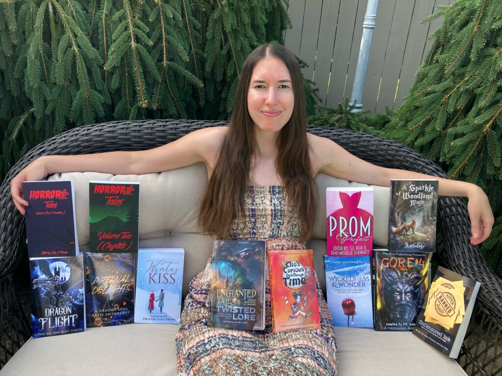 Demi wearing a maxi dress and sitting on a wicker chair with all her anthologies