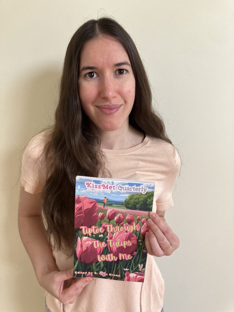 Demi holding her copy of Tiptoe Through The Tulips With Me